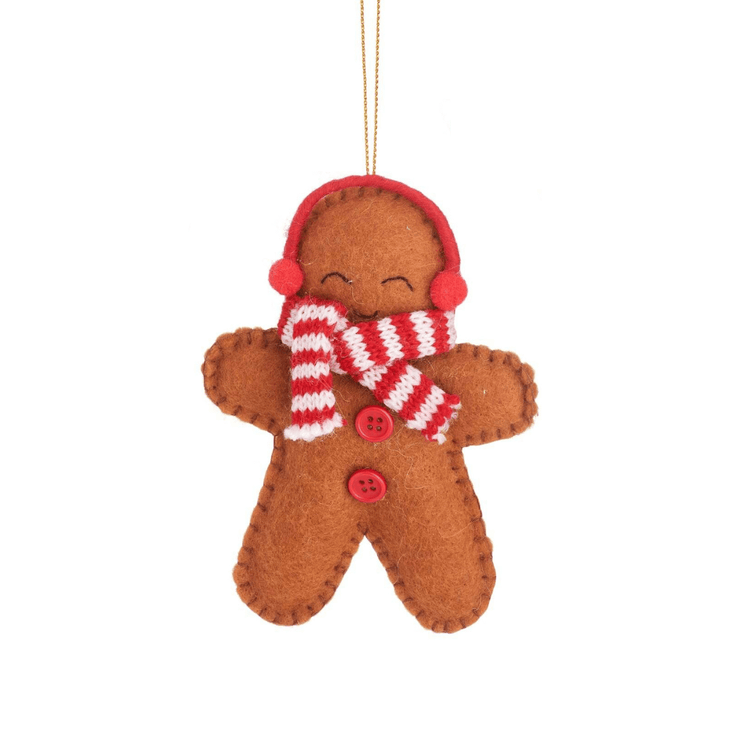 Gingerbread person with a red ear muffs, red and white stripey scarf and red buttons.
