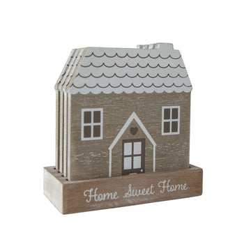 Wooden coasters with a white house painted on them. The coaster case says "Home Sweet Home'