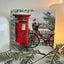 Snowy Postbox Christmas card on a mantlepiece