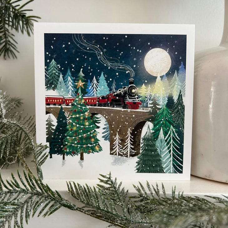 Christmas steam train card on a mantlepiece