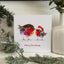 Fluffy robins Christmas card on mantlpiece
