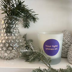 Candle on a Christmas mantlepiece