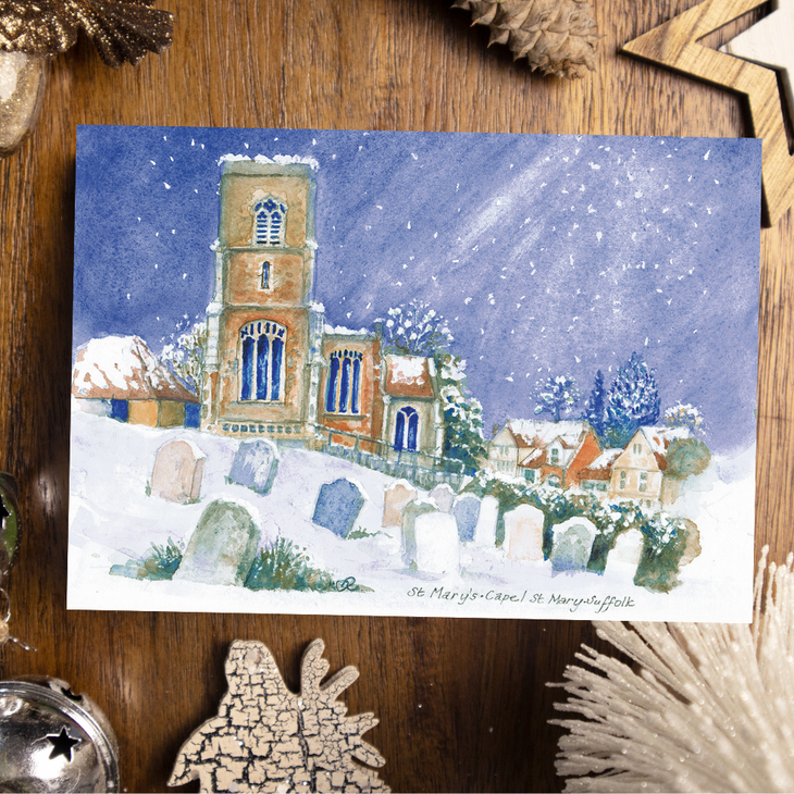 UK Charity Christmas card featuring - a church in a snow-covered landscape