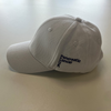 The side of our white cap with our Pancreatic Cancer UK logo in purple